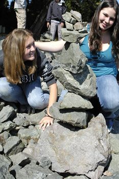  Teens sitting proudly with rock art 
